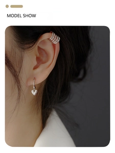 Model show of S925 silver heart charm earrings and multilayer ear cuff set