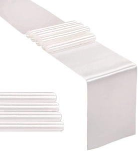 Close-up of silky white satin table runners showing elegant sheen and smooth texture