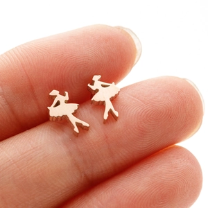 Rose gold ballet dancer stud earrings in stainless steel shown on a hand for scale