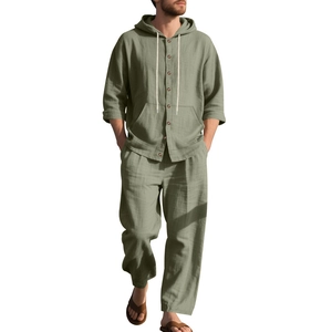 Detail of sage green men linen set showing fabric texture and buttoned hooded shirt
