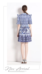 Rear view of vintage blue and white porcelain print dress with ruffled short sleeves
