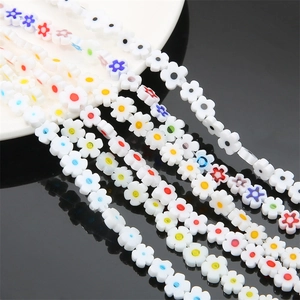 Macro shot of colorful millefiori plum blossom glass beads for DIY jewelry making