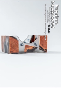 Macro detail of sandalwood and resin tea coaster showing natural wood grain texture