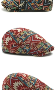 Detailed view of vintage beret hat featuring colorful ethnic geometric jacquard fabric