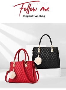 Detail view of quilted leather tote bags in red and black with golden hardware and pom-pom charms