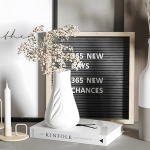 Minimalist white matte ceramic vase with 3D embossed leaf patterns for home floral decor