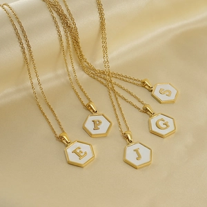 Gold stainless steel hexagonal alphabet necklaces with white shell inlay on silk