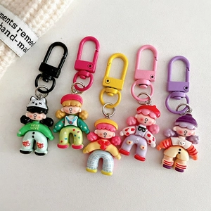 Set of 5 colorful cartoon girl doll keychains with vibrant enamel D-shaped hooks