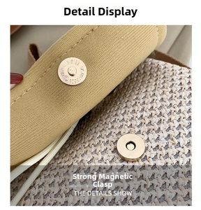 Detailed close-up of the magnetic metal clasp on the woven straw bucket beach bag