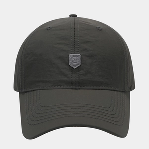 Detail of grey quick-dry baseball cap featuring a shield S embroidery and brim stitching