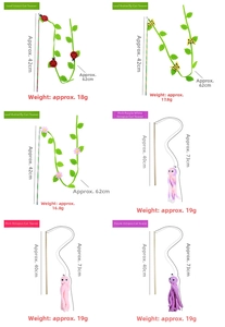 Detailed view of cat wand toy sets with leaves and ocean creature charms for interaction