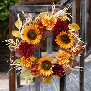 Autumn harvest sunflower wreath with dahlias and corn husks for festive door decor