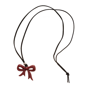 Minimalist red resin bow pendant necklace with black cord and silver accent bead