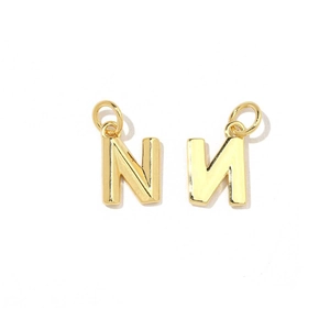 Detail view of two gold letter N charms with 18K plating and cubic zirconia inlay