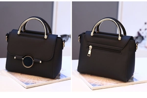 Detail of black lychee leather bag with gold hardware and back zipper pocket