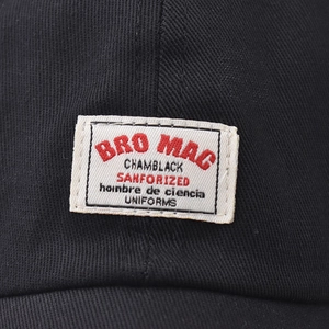 Front view of black short brim baseball cap featuring a retro embroidered logo patch