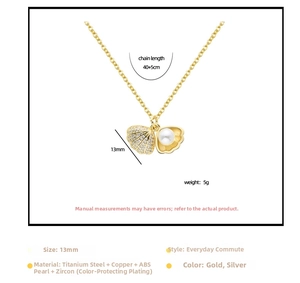Detail view of shell pendant with cubic zirconia and ABS pearl on a gold chain