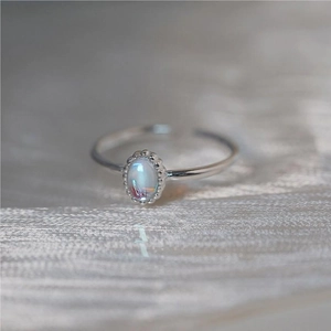 925 sterling silver open ring featuring an oval rainbow gemstone with beaded edge detail