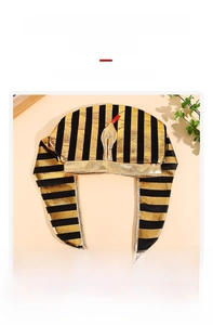 Detail of Egyptian pharaoh hat featuring gold cobra emblem and striped fabric