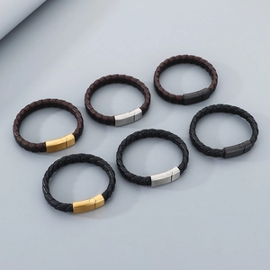 Detail of woven leather bracelets with gold, silver and black magnetic metal clasps