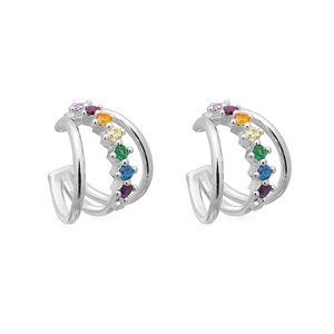 Detail of double-layer silver ear cuffs featuring rainbow zircon stones in prong settings