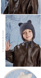 Close-up of kids' winter earflap hat in dark grey faux fur with cute bear ears and ties