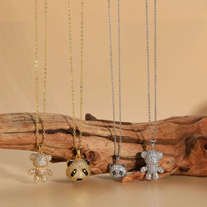 Chic 3D hollow bear and panda necklaces with sparkling zircon pendants on wooden stands