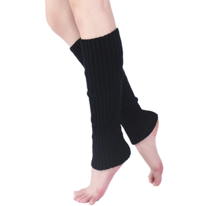 Close-up of black knitted leg warmers showing the ribbed texture and snug fit on legs