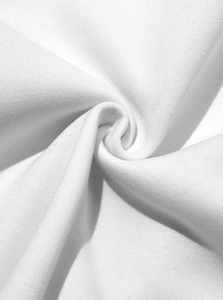 Macro view of soft white knitted fabric texture showing premium cotton weave details