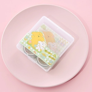 Detail of 12-roll floral washi tape set in a green grid box with cute puppy cartoon