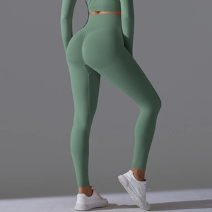 Detail view of high waist seamfree yoga set in sage green showing peach lift and compression