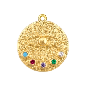 Detailed close-up of a gold evil eye pendant with multi-colored gemstone embellishments