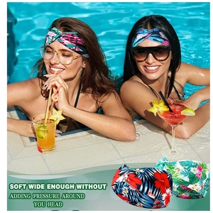 Detail of soft bohemian floral headbands showing wide fit and vibrant tropical patterns