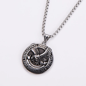 Macro detail of silver eagle pendant with Philippine Eagles engraving and metal chain