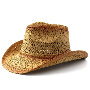 Close-up of a wide-brim straw cowboy hat with a detailed textured weave and dark accents