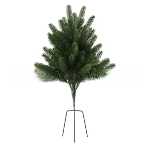 Detail of lush green artificial needles and sturdy metal stand of small Christmas tree