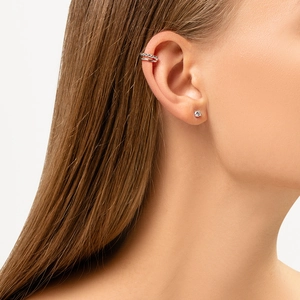 Silver geometric ear cuff and stud earring set with zircons shown on a model's ear