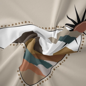 Close-up of bohemian wall tapestry showing textured fabric with abstract sun and mountain prints