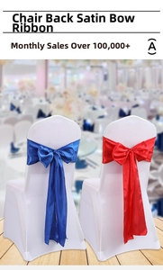 Detail of elegant satin chair back sashes with large bows for wedding banquet decor