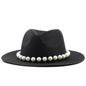 Elegant black straw hat with decorative large faux pearl chain band and classic flat brim