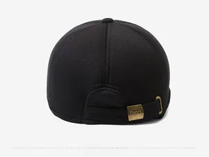 Detail view of the back of a black corduroy baseball cap with an adjustable metal buckle