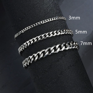 Three Cuban link bracelets in 3mm, 5mm and 7mm widths shown on a professional display