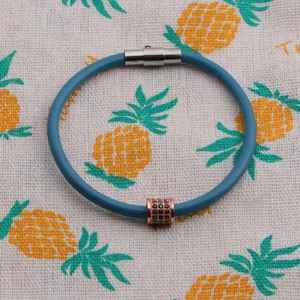 Blue leather magnetic bracelet with rose gold black zircon cylinder charm and silver clasp