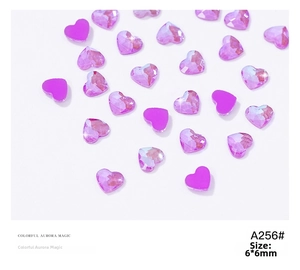 Macro detail of 6x6mm purple aurora heart nail rhinestones with iridescent finish
