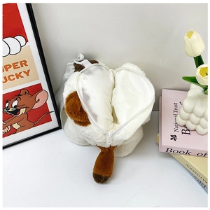Detail of calico cat plush bag featuring back view zipper and adjustable white strap