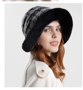Close-up of grey checkerboard plush bucket hat with black faux fur trim and soft lining