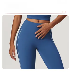 Detail of high-waist yoga leggings with side white stitching and tummy control effect