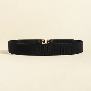 Detailed view of black elastic waist belt featuring a polished gold metal interlocking buckle