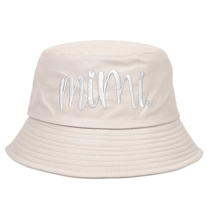 Detailed view of white mimi cursive embroidery on cream canvas bucket hat brim