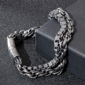 Industrial vintage stainless steel chain bracelet for men displayed on a black gift box